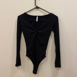 Lulu’s Cheri Black Ribbed Long Sleeve Bodysuit